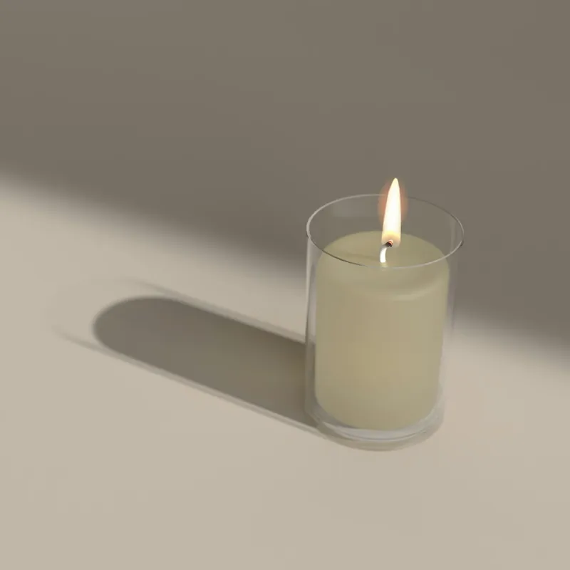 Bougie en pot de verre allumée